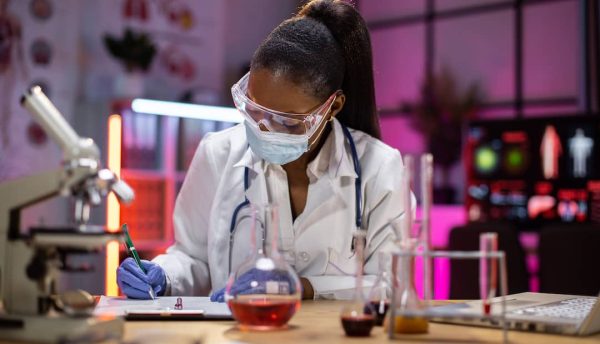 woman-microbiologist-or-medical-worker-writing-res-2023-11-27-05-06-21-utc